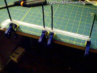 A simple jig for making string heddles.